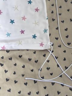 Picture of the product UV50 stroller sunshade – stars and hearts pattern