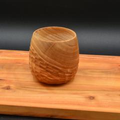 Picture of the product Textured cup 1 – handcrafted ash wood mug with sculpted texture
