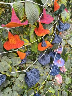 Picture of the product Handmade witch garland – 10 tiny pointed hats in recycled fabric, magical eco-friendly decor for witch lovers